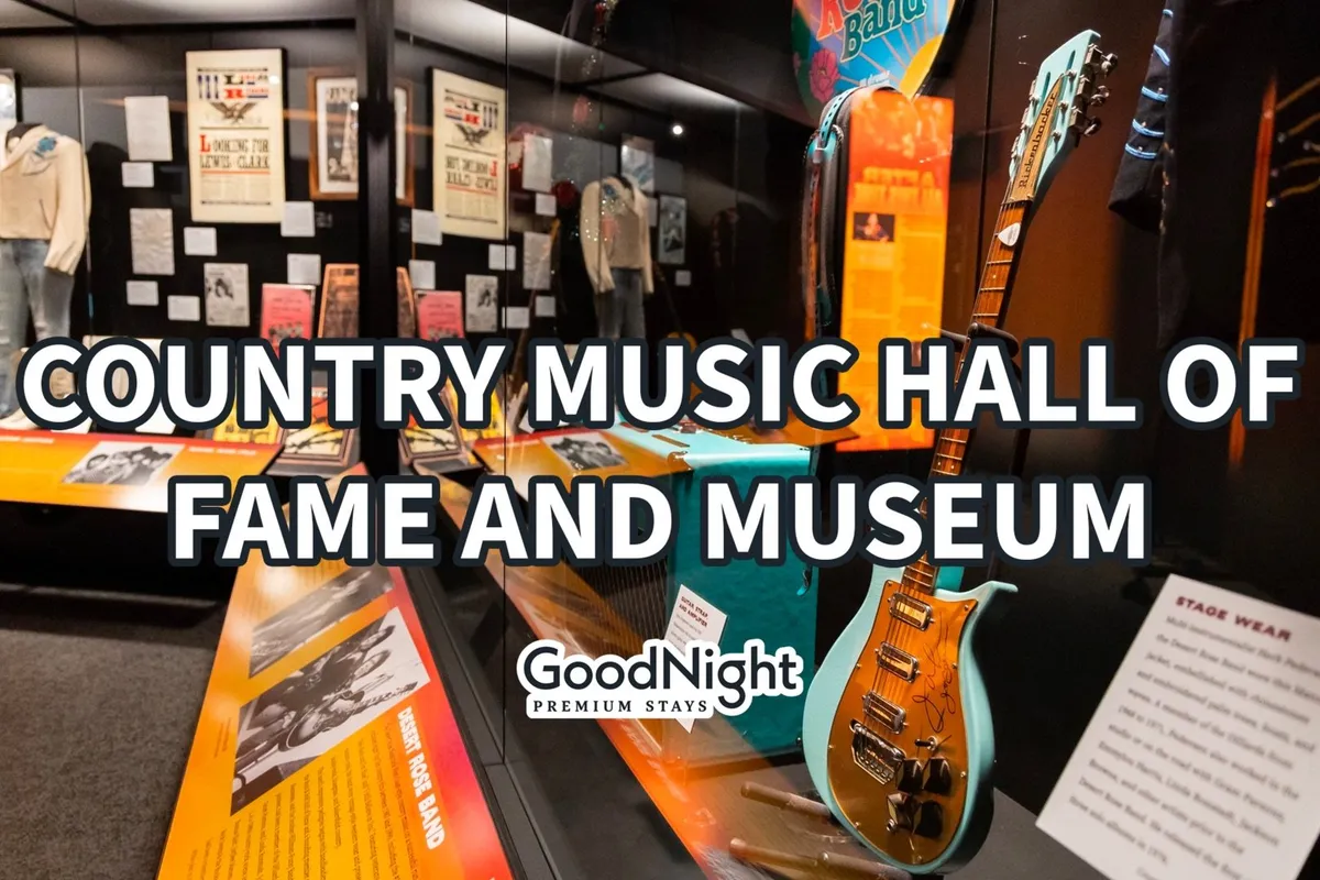 An interior of a museum space displaying guitars, stage wear, and historical memorabilia, evoking the rich music history of Nashville. The display cases and ambient lighting create an inspirational atmosphere for all ages.