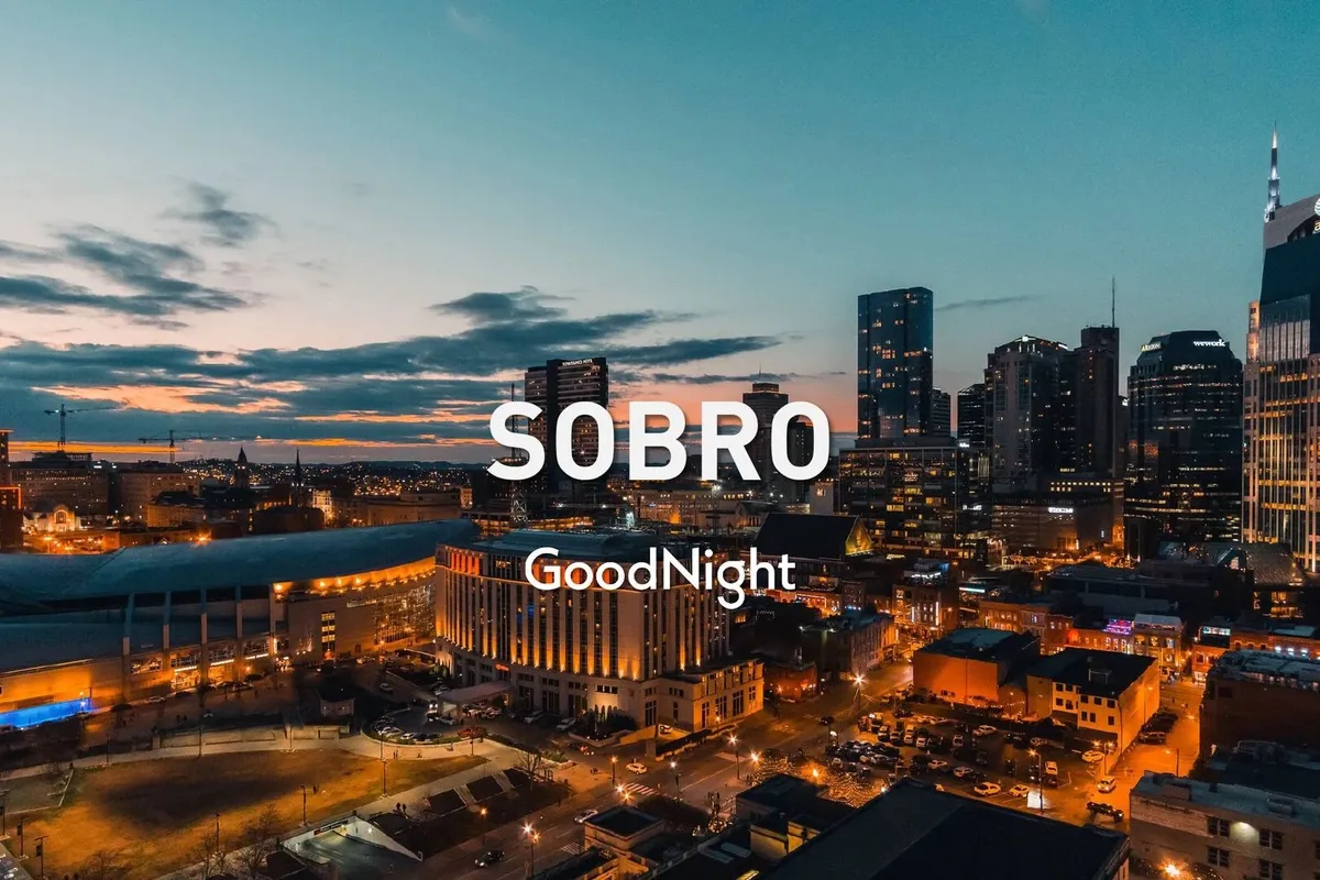 A sweeping view of Nashville's city skyline at sunset with street lights coming to life, evoking the energy and possibilities of urban nightlife and after-hours exploration.